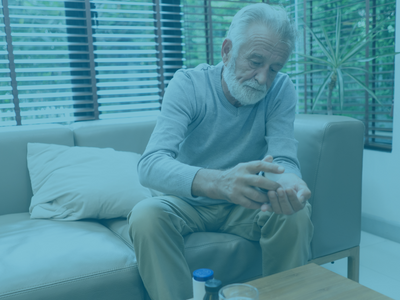 elderly patient taking oral medication at home 